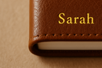 make sure the custom is small at the bottom of the journal , show only the part with the custom initial no need to show the whole book 